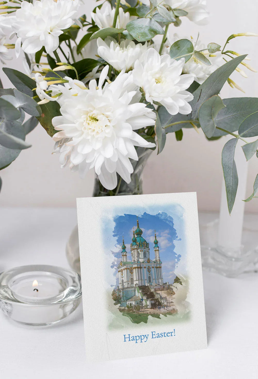 Easter greeting card featuring a watercolor illustration of St. Andrew’s Church with a ‘Happy Easter’ message.