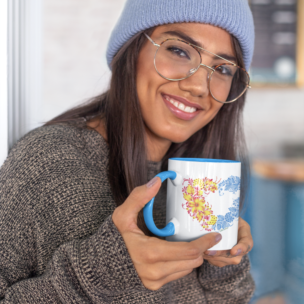 Ceramic mug with heart art featuring traditional Ukrainian folk design