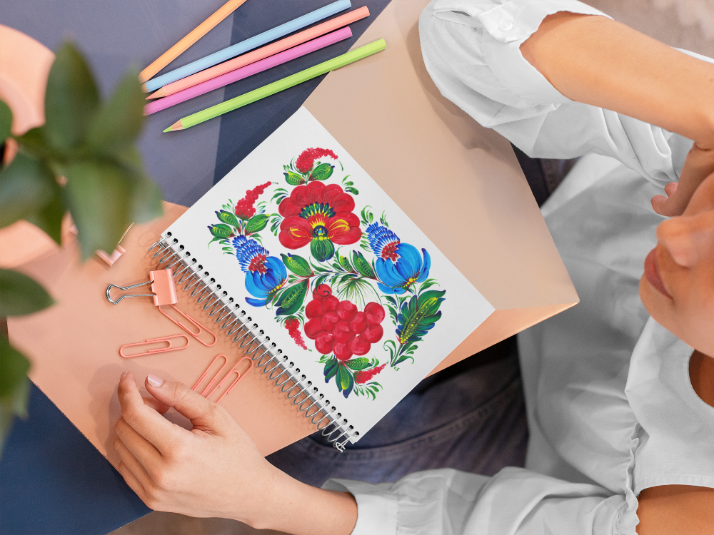 red and blue, floral art on white notebook journal