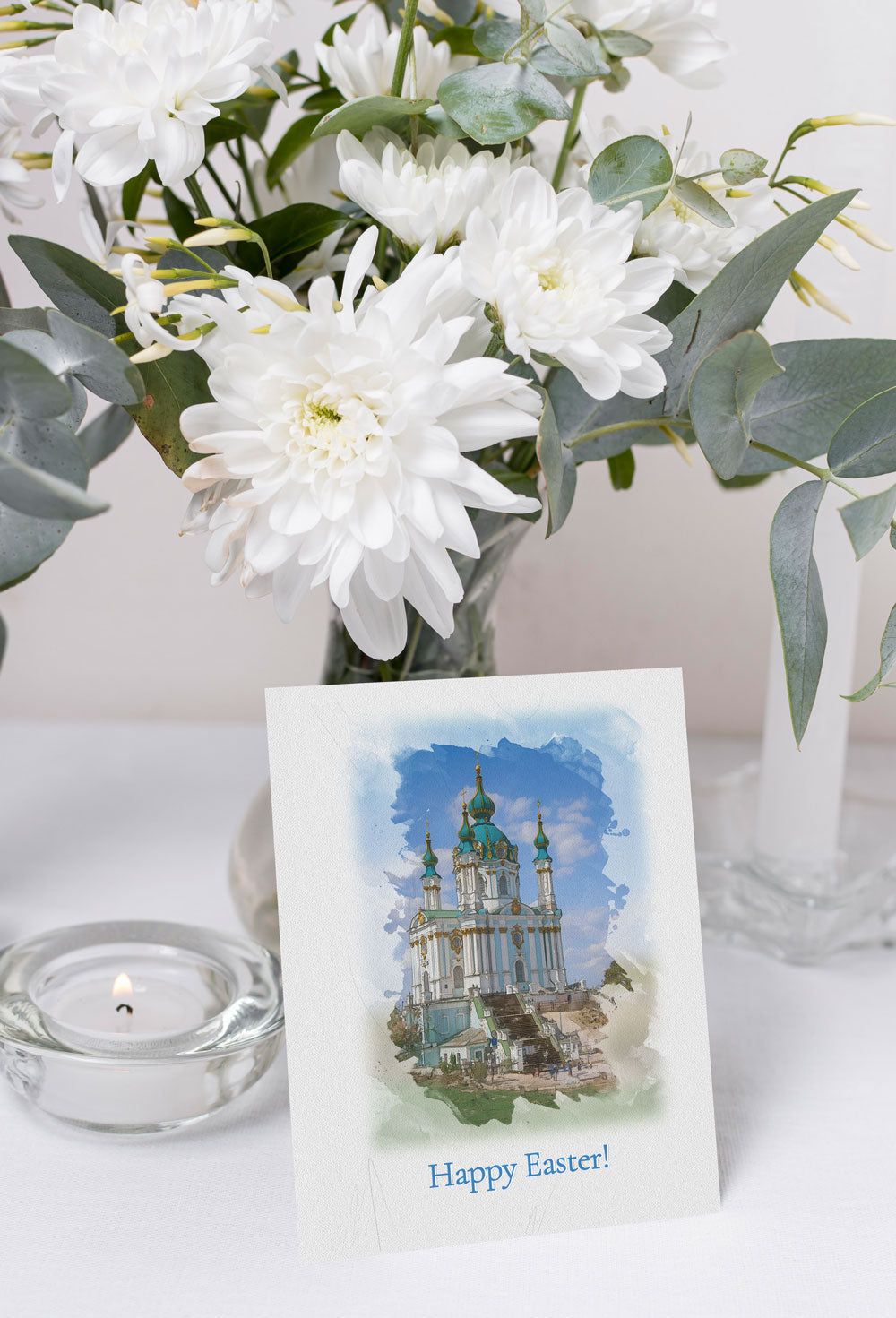 Easter greeting card featuring a watercolor illustration of St. Andrew’s Church with a ‘Happy Easter’ message.