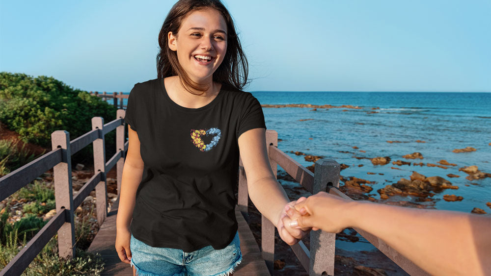 Blue and yellow floral pattern symbolizing Ukrainian culture and heritage in black t shirt