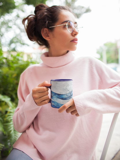 Cozy mug with ice-blue tree design, bringing warmth to winter days